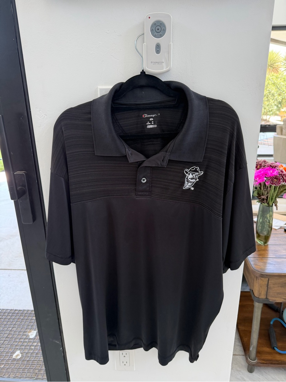 Champion Men’s Black Polo with Embroidered Mascot NM State